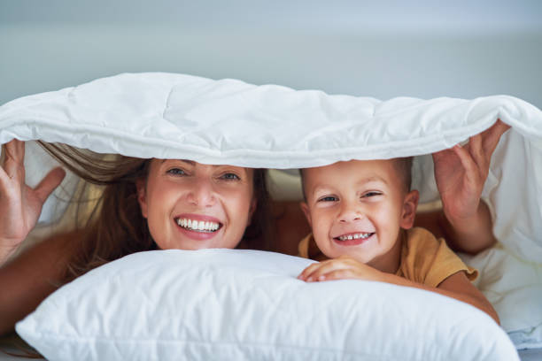 istock Young mother with 4 years old son in bed 1445400976