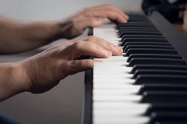 istock Detail of a man playing a midi keyboard 1445401222