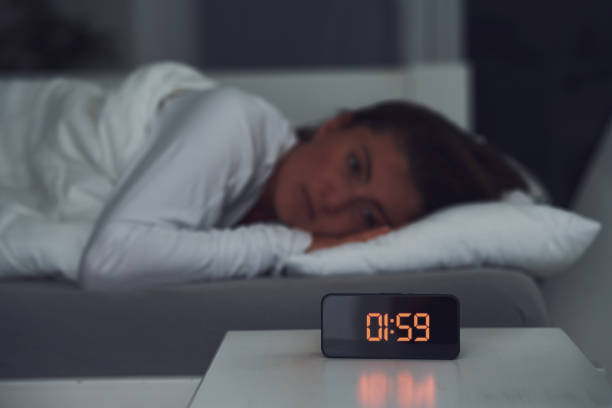 istock Young woman in the bed with sleep problems 1445401617