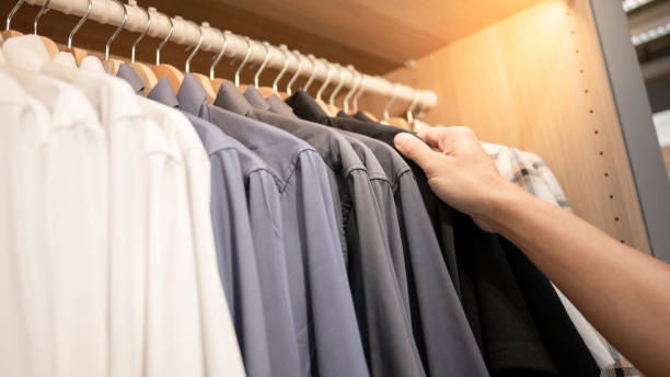 istock Male hand choosing shirt in closet 1445402883