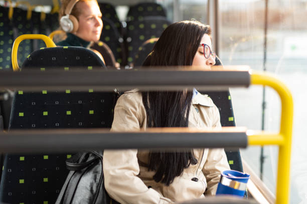 istock Tired woman sleeping in bus 1445404430