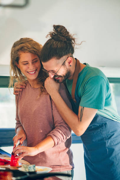 istock Young couple making breakfast together in the kitchen at home 1445405269