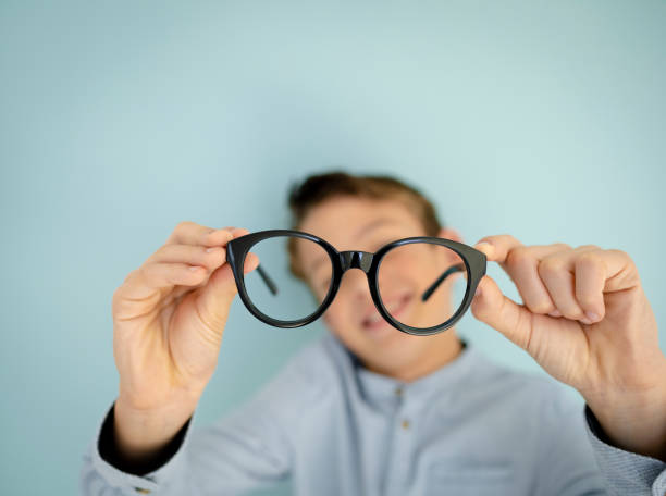 istock young cool boy, with big massive black glasses 1445412277
