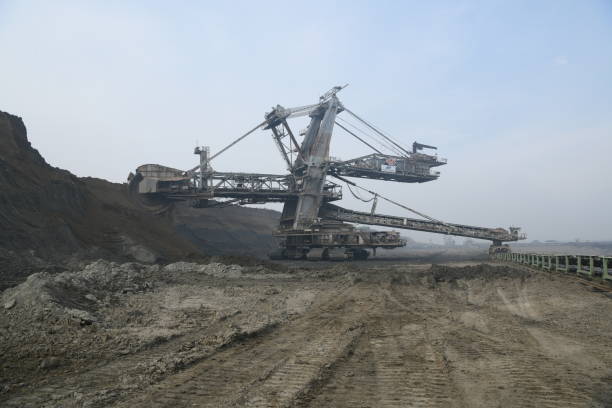 istock Bucket-wheel excavator during excavation at the surface mine. Huge excavator on open pit mine. 1445413397
