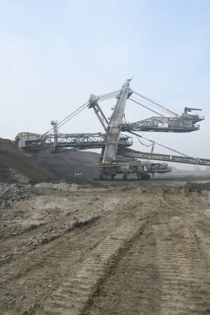 istock Bucket-wheel excavator during excavation at the surface mine. Huge excavator on open pit mine. 1445413401