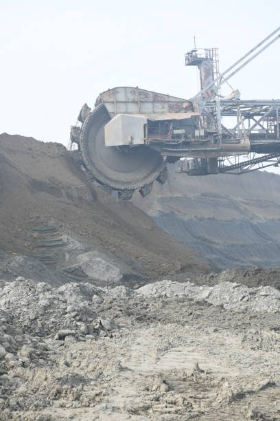 istock Bucket-wheel excavator during excavation at the surface mine. Huge excavator on open pit mine. 1445413402