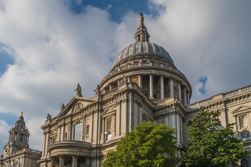 Beautiful St. Paul's Cathedral with the dome on top, next to a sky with clouds, London, United Kingdom
