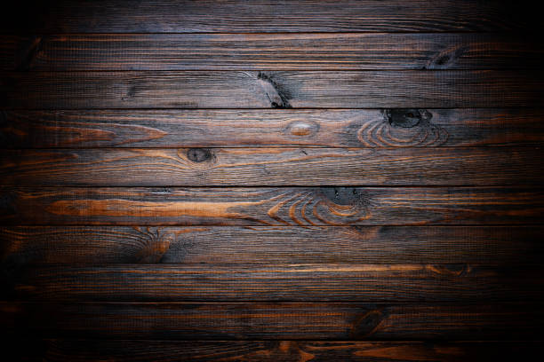 istock Dark stained wood texture, vignette wood background 1445417701
