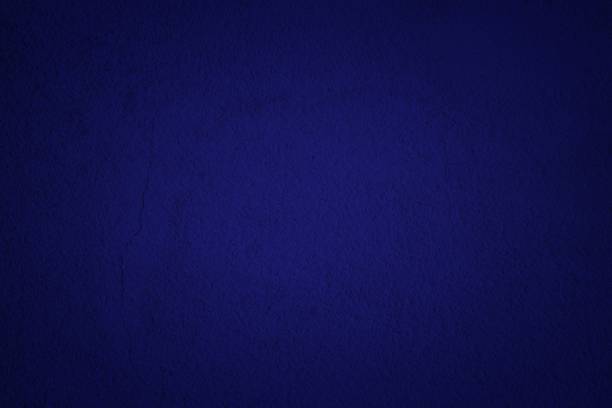 istock Phantom Blue Concrete Wall Texture Background in Midnight Tone with Lighten Center, Suitable for Wallpaper, Backdrop, Mockup, and Web Design. 1445419126