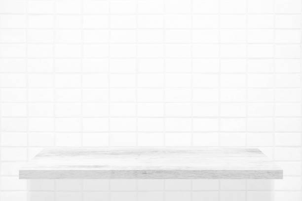 istock White Wooden Shelf on Mosaic Tile Wall Texture Background. 1445419267