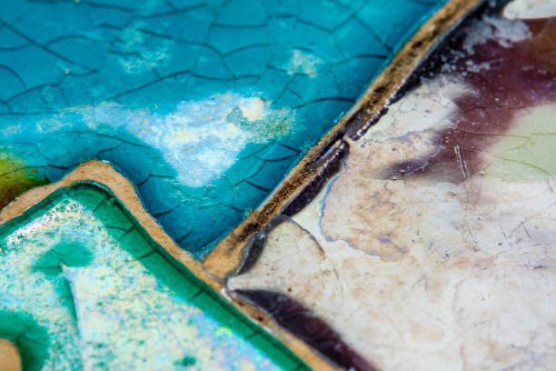 istock Close-up of a surface covered with old glazed paint in soft focus at high magnification. Hand-painted vintage things with small cracks. 1445419424