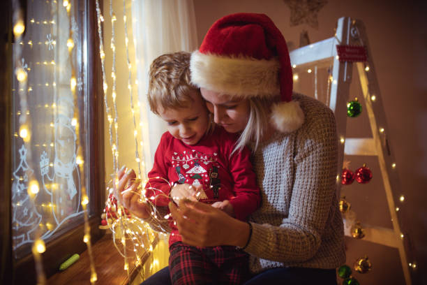 istock Mother and son enjoy in Christmas night 1445421668