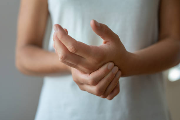 istock Woman massage on hand pain 1445422810