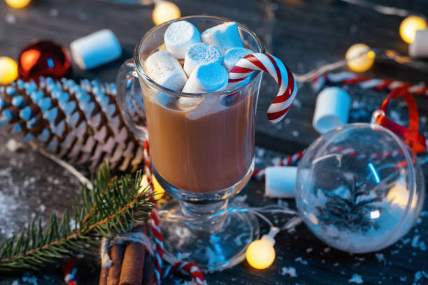 istock Hot cocoa with marshmallows and cinnamon on a wooden blue table close-up 1445422850