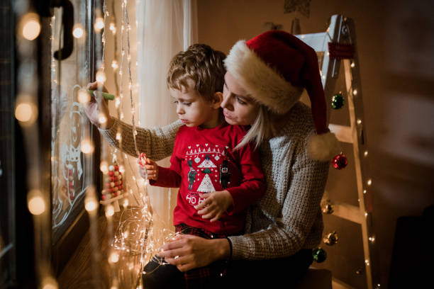 istock Little boy draws on a window in the winter 1445422927