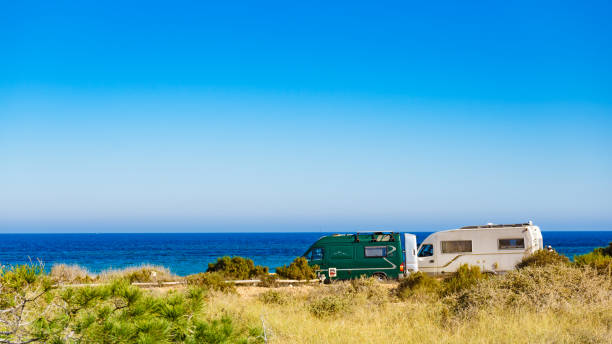 istock Camper car on beach, camping on seashore 1445423188