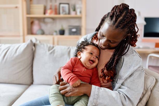 Little smiling baby boy and his mom