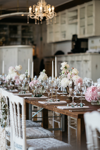 Romantic wedding banquet with candlestick holders an white and pink flowers