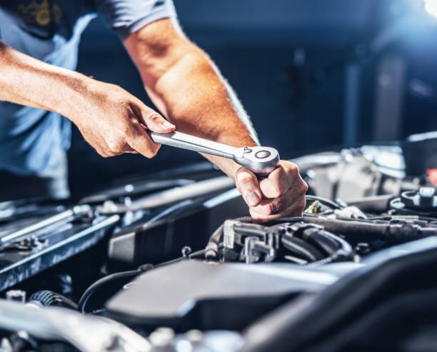 istock Auto mechanic working in garage. Repair service. 1445429872