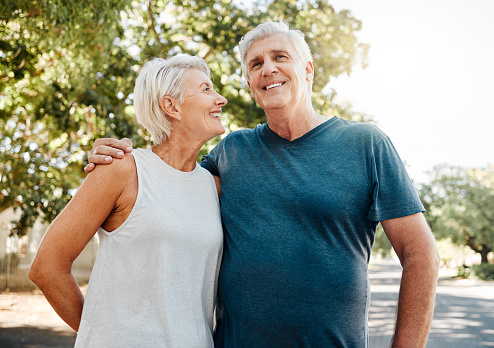 Senior couple smile after running for exercise, fitness and health in retirement together. Elderly runners rest after workout, doing low impact cardio run and sports training to stay healthy in life