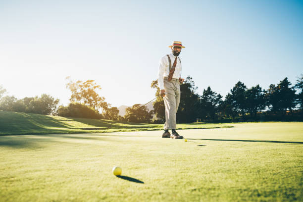 istock Black golfer man next to a golf hole 1445432089