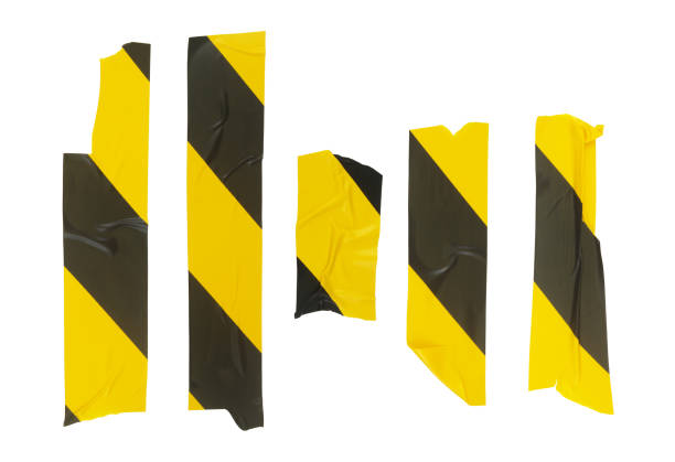 istock Many yellow and black adhesive tapes isolated on white 1445434496