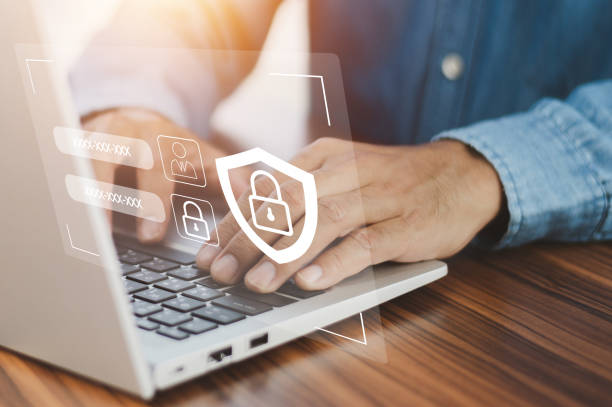 istock Businessman using password Cybersecurity and privacy concepts to protect data. Lock icon  internet network security technology. Businessmen protecting personal data on laptop and virtual interfaces. 1445440845