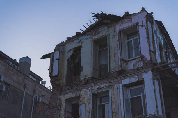 istock House being demolished. Dark and abandoned, in the evening. 1445442292