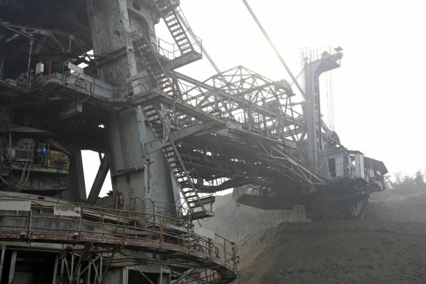 istock Bucket-wheel excavator during excavation at the surface mine. Huge excavator on open pit mine. 1445443501