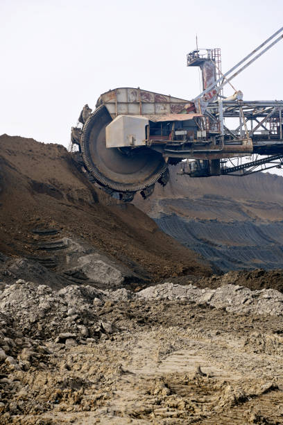 istock Bucket-wheel excavator during excavation at the surface mine. Huge excavator on open pit mine. 1445443582