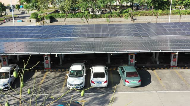 Electric vehicle charging station with solar panels