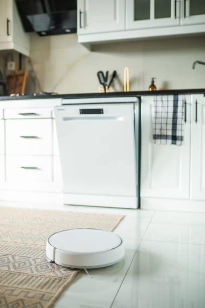 istock Technology in the Kitchen, Robot Vacuuming and Cleaning 1445456333
