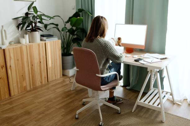 istock Rear view of a female student studying online 1445460230