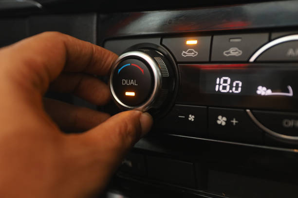 istock Woman regulating car air condition. Modern car interior 1445462634