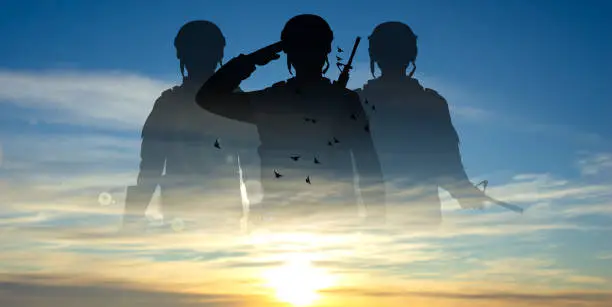 Vector illustration of Military silhouettes of soldiers against the sunset or sunrise. Concept for Armed Forces Day.