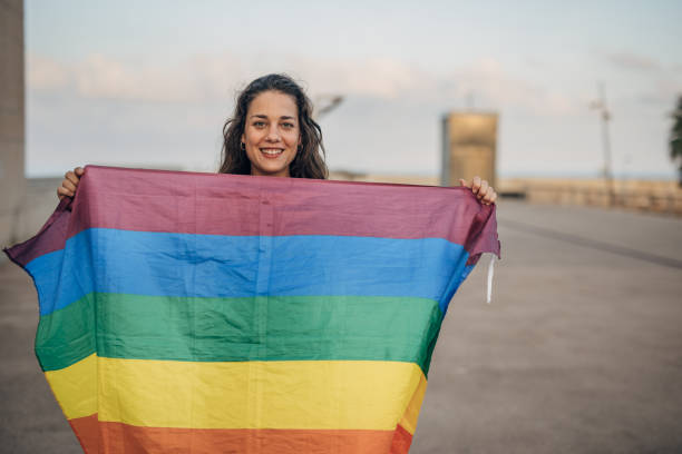 istock Woman with pride flag 1445468480