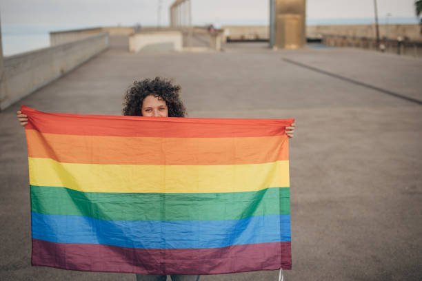 istock Woman with pride flag 1445468494