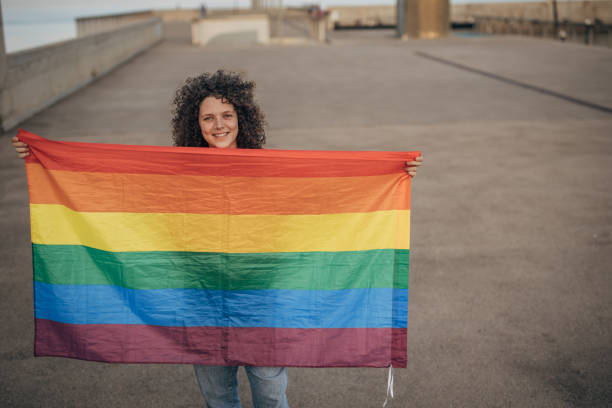 istock Woman with pride flag 1445468509