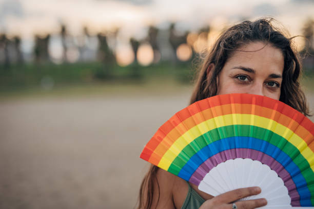 istock Woman with pride hand fan 1445468788