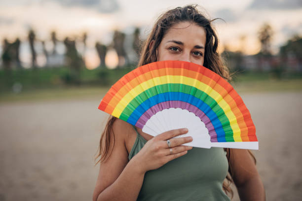 istock Woman with pride hand fan 1445468861
