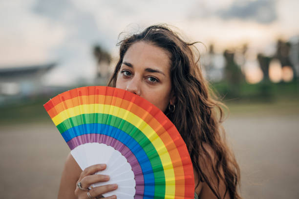 istock Woman with pride hand fan 1445468978