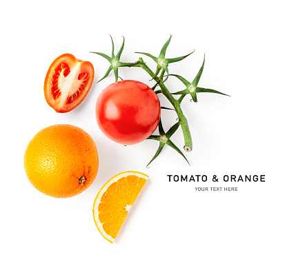 Fresh tomato and orange fruit composition isolated on white background. Creative layout. Healthy eating and dieting food concept. Flat lay, top view. Design element