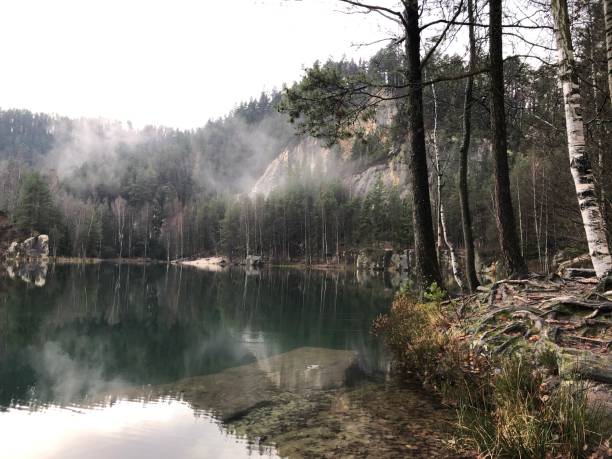 istock Lake and mountains. Autumn nature 1445477408