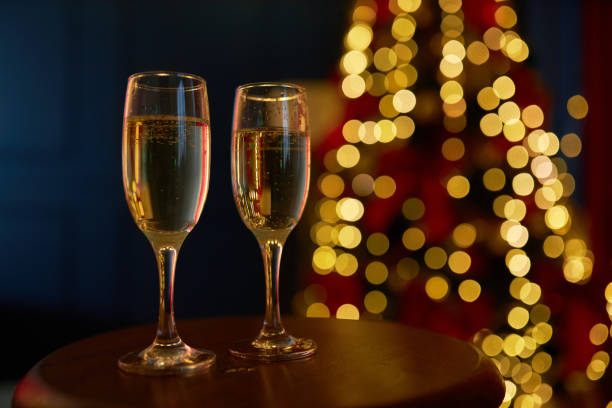 istock Two glasses of champagne, sparkling wine standing on table. 1445478707