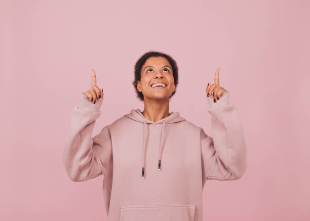 istock Young black excited woman pointing upwards. 1445480857