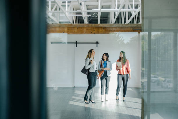 istock Diverse businesswomen discuss loft office space 1445481982