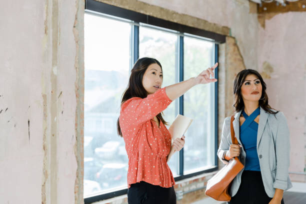 istock Real estate agent points out loft features to business client 1445482034
