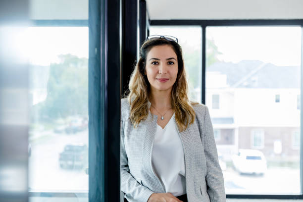 istock Female administrator stands by office for photo 1445483090
