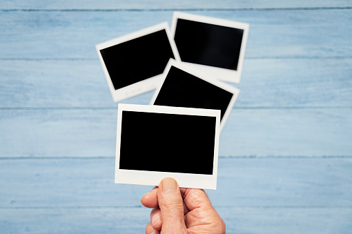 Instant camera prints on a table