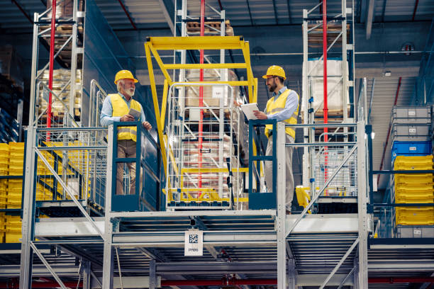 istock Business people in warehouse discussing about new project 1445487491